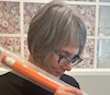 Susan Karcz holding a large pencil
